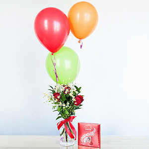 Red rose 50 cm - 7, Chamomile - 3, Aspidistra (1 pc.), Ruscus, Ribbon, Lindt Candy Box, Helium Balloon (1 pc.)