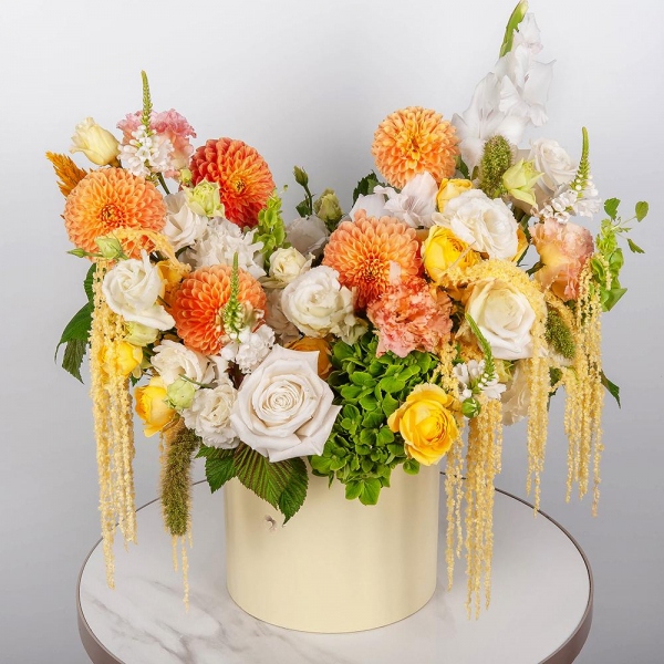 Orange Dahlia - 5, Green Hydrangea - 1, lisianthus - 4, White Gladiolus - 1, Spray rose: yellow, orange 50 cm - 4, White rose 50 cm Ecuador - 9, Round flower box medium, Oasis, Veronica spray, Astilbe, Amaranth stabilized,  Raspberry branch
