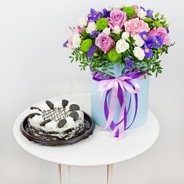 Deep Purple rose - 7, Spray rose: white, cream, light pink 50 cm - 11, Pink carnation - 5, Irises - 5, Athos pom Feeling Green - 4, Round flower box medium, Oasis, Film, Pistachio, Blue Statice, Cake in assortment, Ribbon