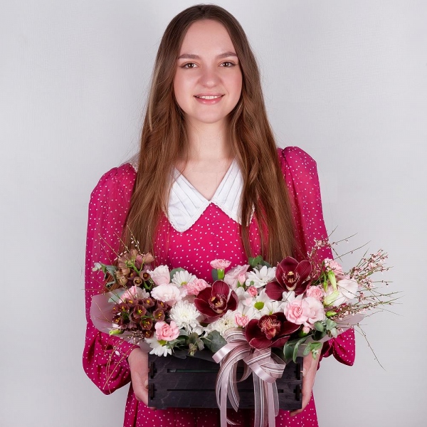 Pink Cymbidium Orchid Bud - 3, Baltica White Spray Chrysanthemum - 1, Pink Lisianthus (Eustoma) - 3, Pink spray carnation - 3, White Delphinium - 2, Bacardi White Spray Chrysanthemum - 1, Wooden pot, Oasis, Wrapping Paper, Flask for orchids, Eucalyptus, Genista