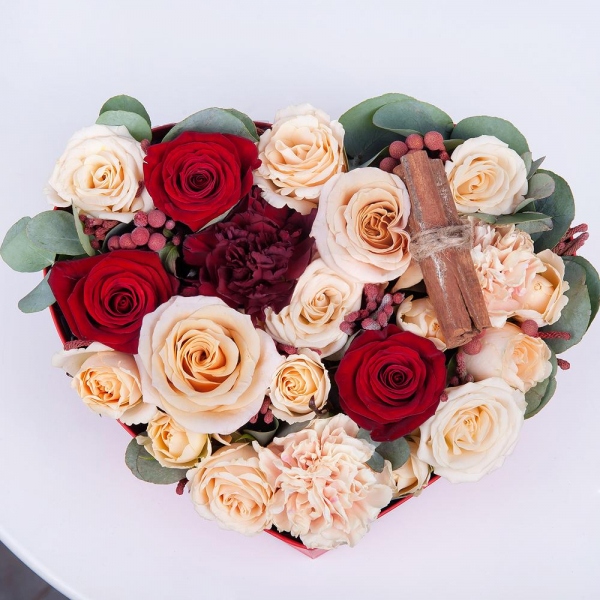Red rose 50 cm - 4, Rose Cream 50 cm - 3, Carnation white, cream - 3, Spray rose: white, cream, light pink 50 cm - 4, Carnation red - 2, Heart‑shaped box for arrangements, Oasis, Cinnamon decorative packaging, Eucalyptus Cinerea, Brunia Green Lanuginosa (1 pc.)