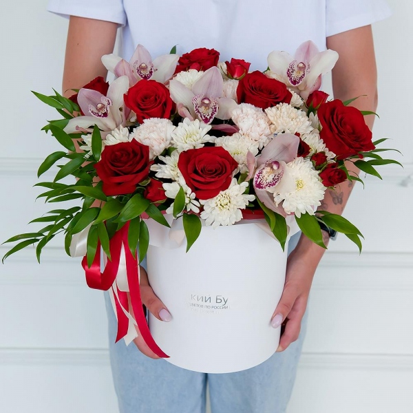 Red rose 50 cm - 9, Pink Cymbidium Orchid Bud - 6, Baltica White Spray Chrysanthemum - 4, Spray rose: red 50 cm - 2, Carnation white, cream - 5, Round flower box medium, Flask for orchids, Oasis, Ruscus italian, Ribbon