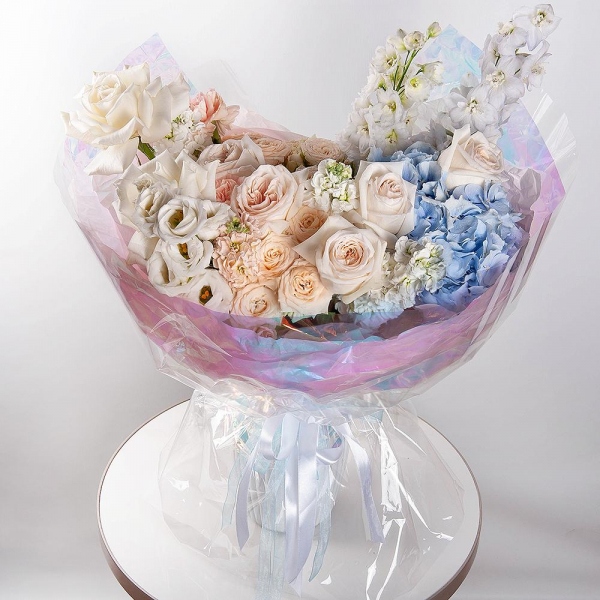 White rose 50 cm Ecuador - 2, Blue/purple hydrangea - 1, Spray peony rose  - 5, Carnation white, cream - 7, White Matthiola - 4, Baltica White Spray Chrysanthemum - 1, lisianthus - 1, Blue Delphinium, Wrapping Paper