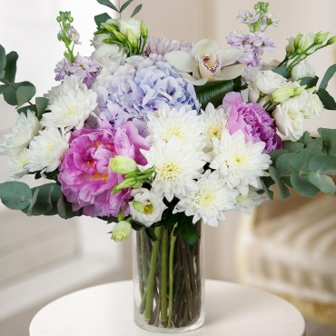 Hydrangea - 1, Peonies - 2, Cymbidium Orchid bud - 1, Baltica White Spray Chrysanthemum - 2, Matthiola Lilac - 2, lisianthus - 3, Baltica Pink Spray Chrysanthemum - 1, Flask for orchids, Aspidistra (1 pc.), Eucalyptus Cinerea, Wrapping Paper, Ribbon
