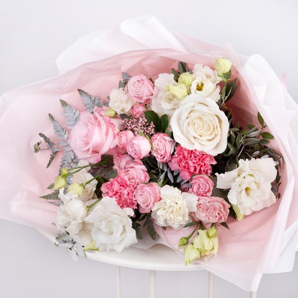 Pink rose 50 cm - 2, White rose 50 cm - 3, Bright pink spray rose mix, 50 cm - 3, Carnation white, cream - 3, lisianthus - 3, Pink carnation - 2, Ozotamnus, Pistachio, Fern (1 pc.), Wrapping Paper