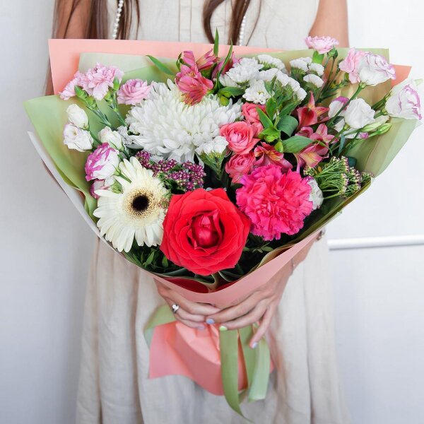 Magnum White Chrysanthemum - 1, Gerbera white - 1, Pink carnation - 2, Santini White Spray Chrysanthemum - 2, Bright pink spray rose mix, 50 cm - 1, Alstromeria white, soft pink - 3, Red rose 50 cm - 1, Pink Lisianthus (Eustoma) - 2, Pink spray carnation - 2, Ozotamnus, White statice, Pistachio, Wrapping Paper