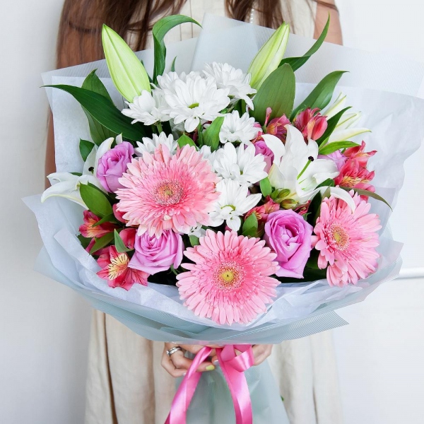 Lilies - 2, Alstromeria Red, Bright Pink - 3, Gerbera pink - 3, Pink rose 50 cm - 7, Bacardi White Spray Chrysanthemum - 3, Pistachio, Ruscus, Wrapping Paper, Ribbon
