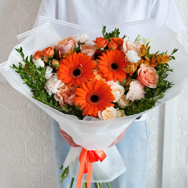 Gerbera daisies - 3, Pink-orange rose Phoenix 50 cm - 7, Alstromeria Yellow, Orange - 5, Spray rose: yellow, orange 50 cm - 2, lisianthus - 1, Carnation white, cream - 7, Spray rose: white, cream, light pink 50 cm - 2, Pistachio, Wrapping Paper