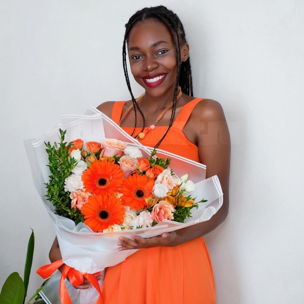 Gerbera daisies - 3, Pink-orange rose Phoenix 50 cm - 7, Alstromeria Yellow, Orange - 5, Spray rose: yellow, orange 50 cm - 2, lisianthus - 1, Carnation white, cream - 7, Spray rose: white, cream, light pink 50 cm - 2, Pistachio, Wrapping Paper