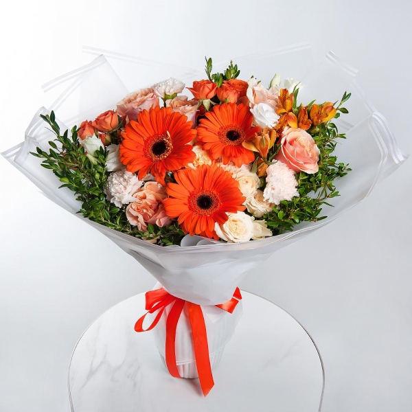 Gerbera daisies - 3, Pink-orange rose Phoenix 50 cm - 9, Alstromeria Yellow, Orange - 6, Spray rose: yellow, orange 50 cm - 2, lisianthus - 1, Carnation white, cream - 10, Spray rose: white, cream, light pink 50 cm - 3, Pistachio, Wrapping Paper