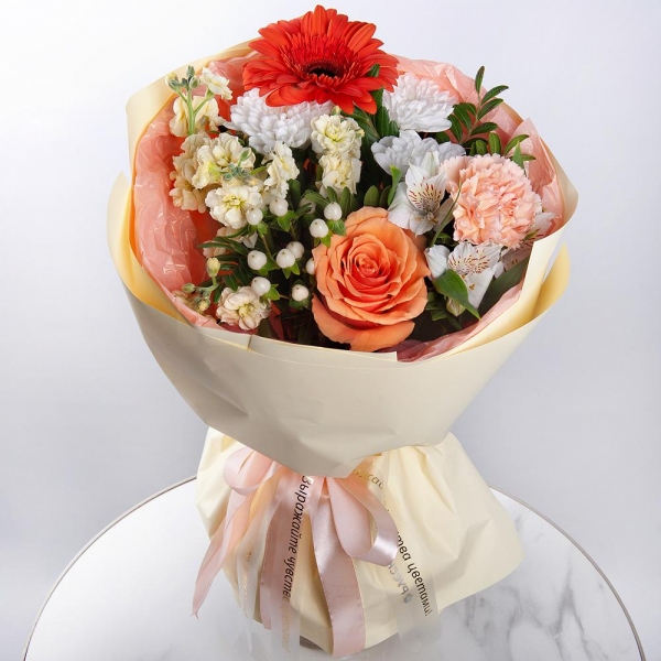 Gerbera daisies - 1, Baltica White Spray Chrysanthemum - 1, White Matthiola - 1, Alstromeria white, soft pink - 3, Pink carnation - 4, Rose Cream 50 cm - 1, Hypericum, Pistachio, Wrapping Paper